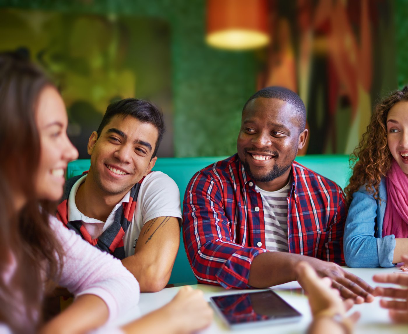 community people sitting next to each other laughing.jpg